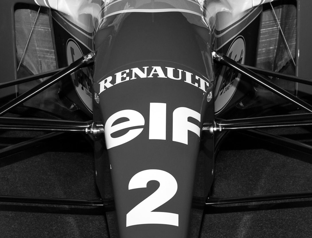 Head-on: the narrow nose of a Formula One car lettered ‘Renault’ and ‘elf’ above a large number 2, its suspension arms spreading out to either side.
